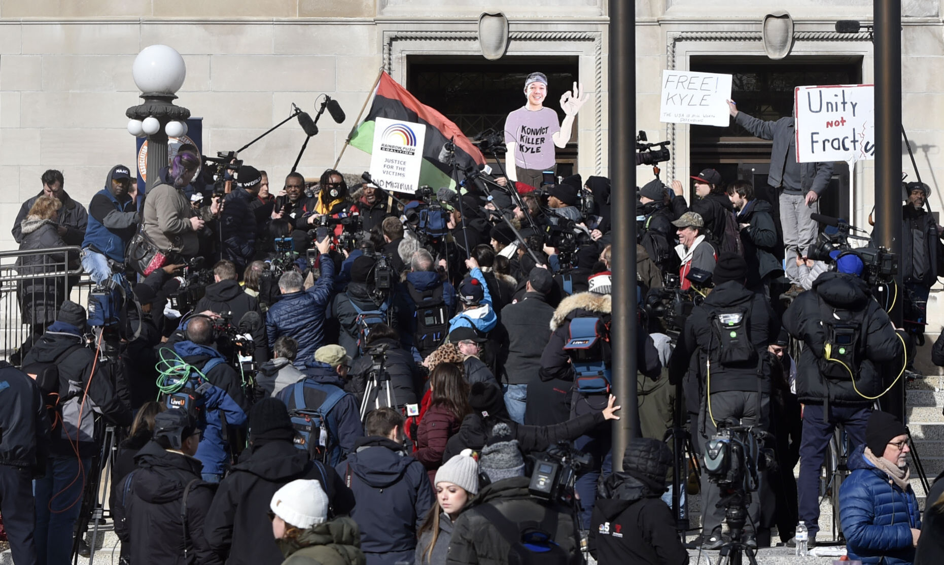 Media, demonstrators crowd Kenosha County Courthouse steps